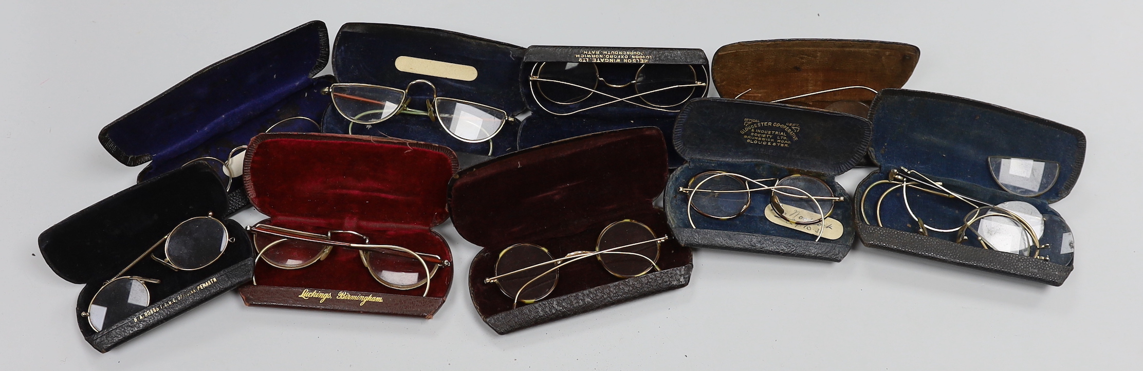 A quantity of spectacles and cases